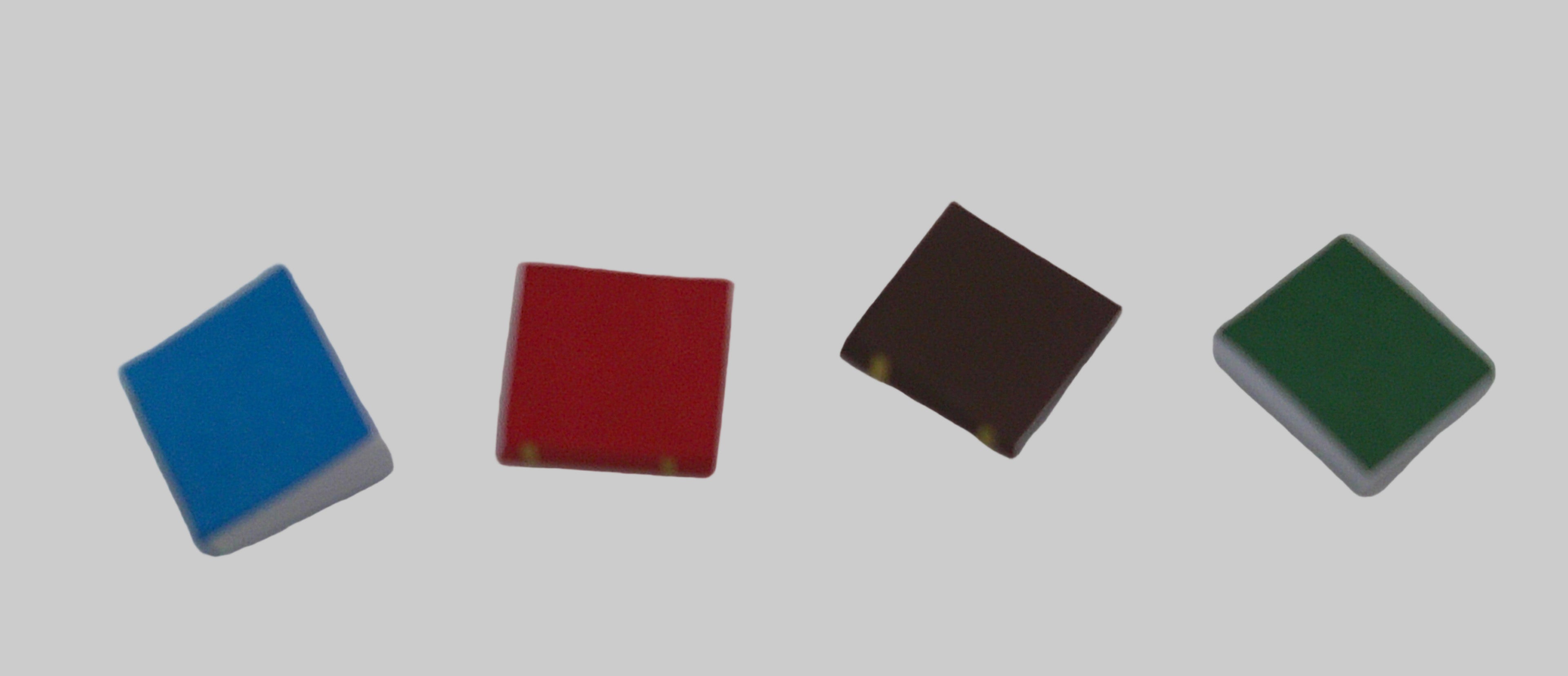 Four colored square blocks on a white background