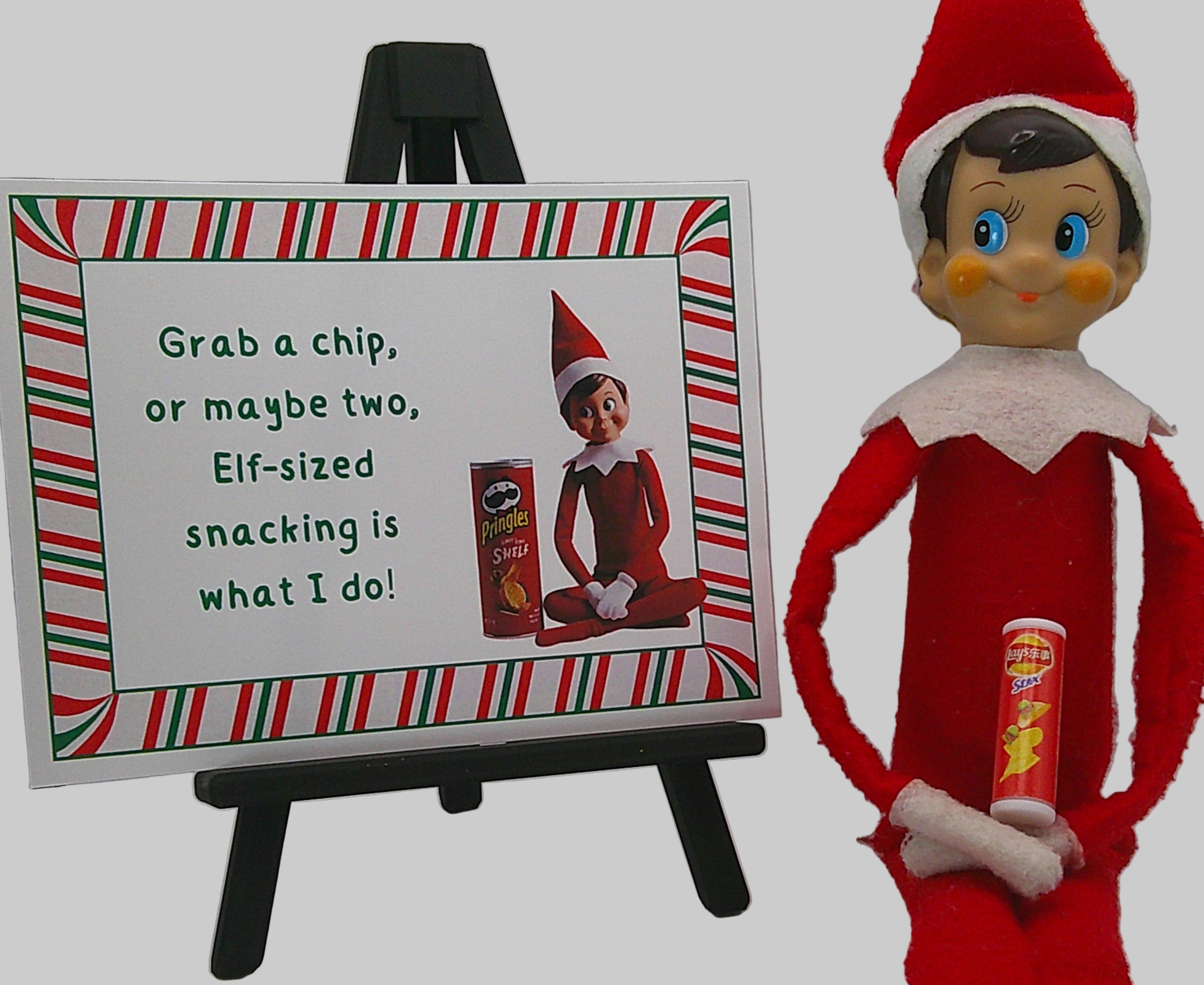 Elf on the Shelf holding a Pringles chip can next to a sign with humorous text.