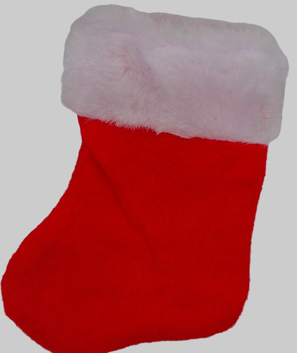Red Christmas stocking with white fur trim on a light gray background