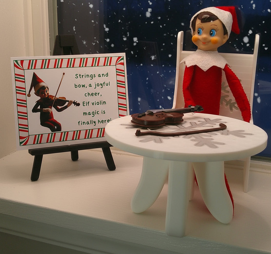 Elf on the Shelf with violin and sign on a white surface